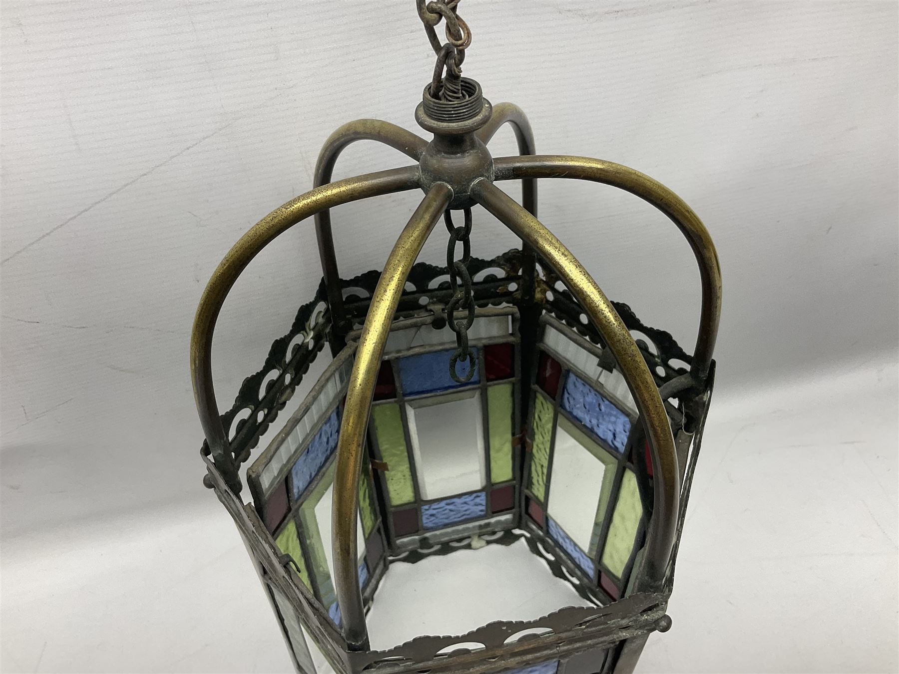 Victorian brass and stained leaded glass hall lantern, of hexagonal form, supported by four domed arms and pierced fret, H46cm W20cm
