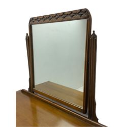 Mid-20th century Jacobean design medium oak dressing table, raised swing mirror over five drawers 