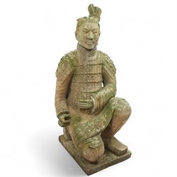Two near life-size terracotta warrior figures, modelled in the style of the Qin dynasty soldiers, each kneeling with one arm raised, wearing detailed armour and tunics, one example partially damaged and lacking sections