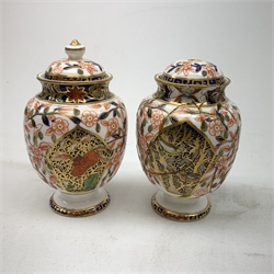 Three Bloor Derby Imari pattern twin handle urms, two examples with covers, each with mark beneath, H12cm, (all a/f), together with a pair of late 19th century Royal Crown Derby Imari pattern urns and covers, each with mark beneath, H13cm, (one significantly a/f). 