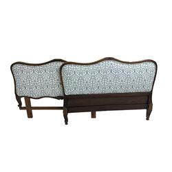 French style shaped head and foot boards, moulded frames carved with foliage, upholstered in blue and white patterned fabric 