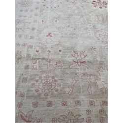 Persian design pale ivory ground carpet, decorated with stylised plant and leaf motifs in pale red