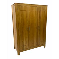 Oak triple wardrobe, fitted with hanging space and shelves 