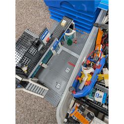Large collection of Lego, including partially built vehicles, Police Station, Lego Creator 31010 and a collection of Lego instruction booklets