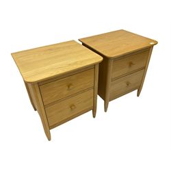 Pair light oak two drawer bedside chests