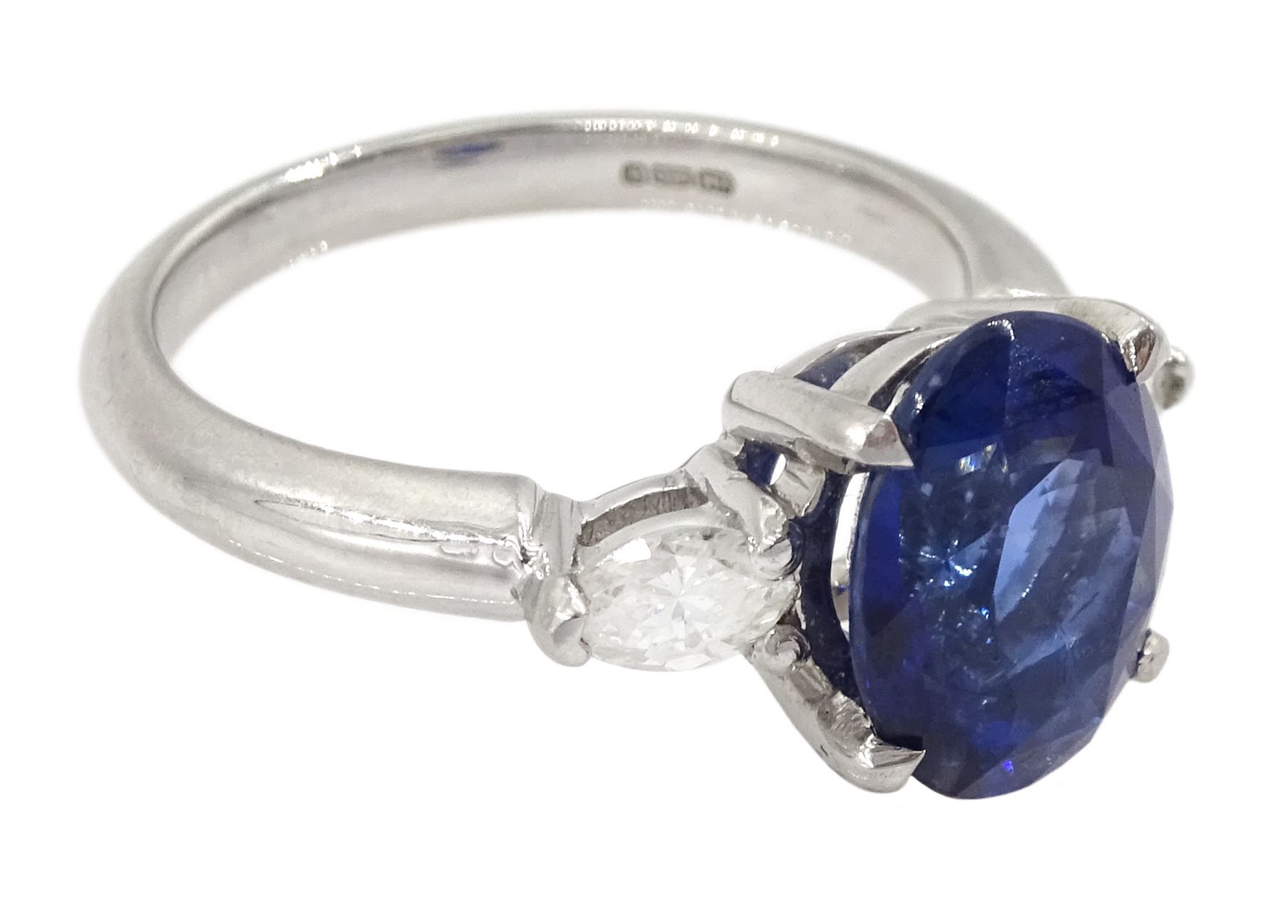 Platinum three stone oval cut sapphire and pear cut diamond ring, hallmarked, sapphire approx 2.70 carat