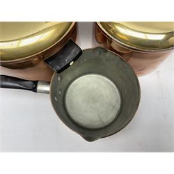 Set of four Jonart copper sauce pans with brass lids