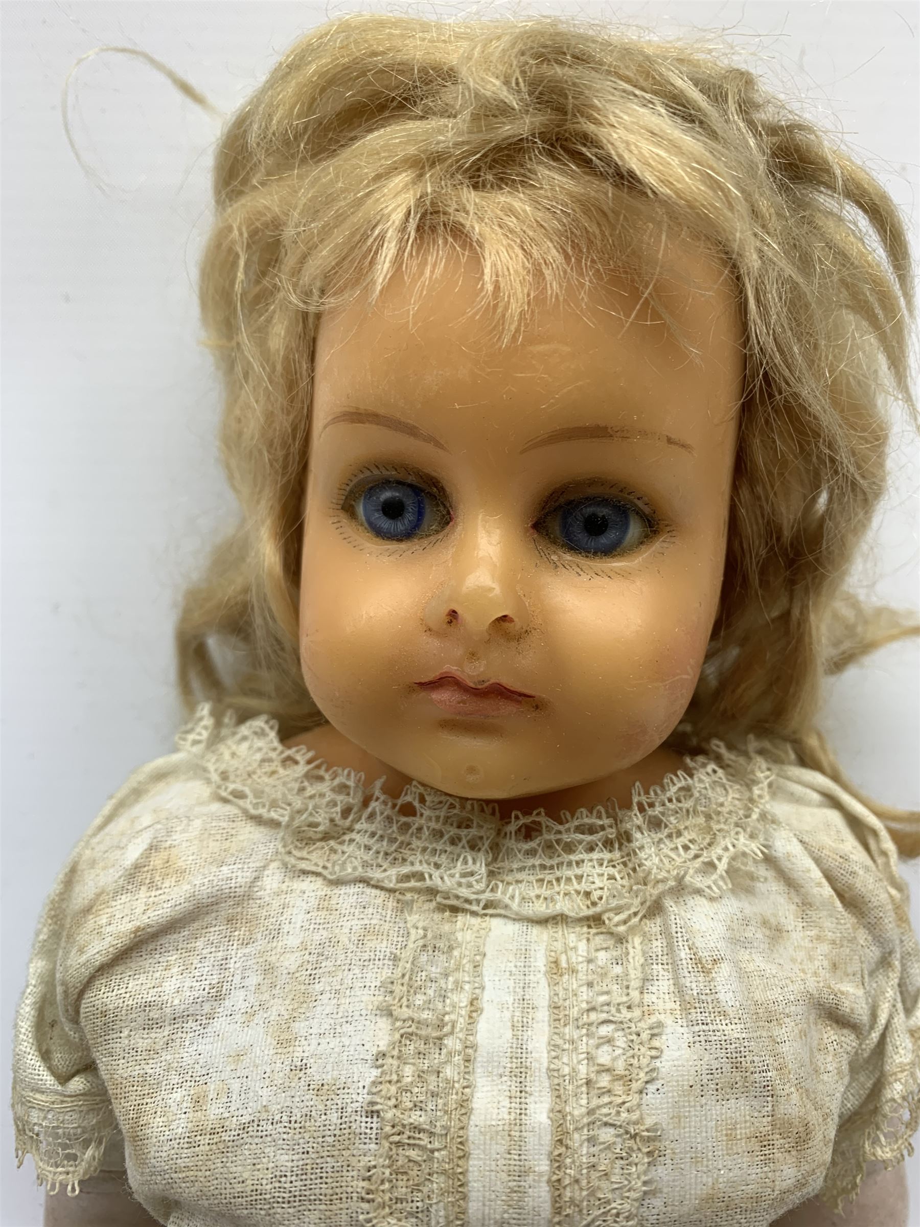 Early 20th century Cuno and Otto Dressel wax shoulder head doll with applied hair and fixed glass eyes, soft body with jointed composition lower limbs, maker's stamp to right thigh, clothing and box H38cm in original box