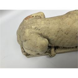 Two early 20th century reconstituted stone Grand Tour or Chatsworth House type lions after Antonio Canova, each modelled in recumbent pose upon a rectangular plinth, signed to plinth Dilettanti, each approximately L31cm