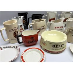 Collection of ceramic pub jugs and ashtrays, including Senior Service ashtray, Bell's old scotch whiskey ashtray,Arthur Bell & sons jug, Beefeater gin jug, two Black and White scotch whiskey jugs, etc    