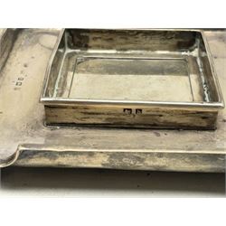 Edwardian silver stand, of square shaped form, upon four bun feet, hallmarked Birmingham 1907, together with an early 20th century silver mounted photograph frame, hallmarked Birmingham 1918, approximate weighable silver 93.6 grams