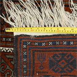 Afghan Turkmen Ersari hand-knotted rug, warm brown field decorated with a vertical arrangement of the elongated geometric guls formed by ram's horn hook motifs, enclosed by narrow ivory guard stripes, and a broad main border, with cotton fringe ends 