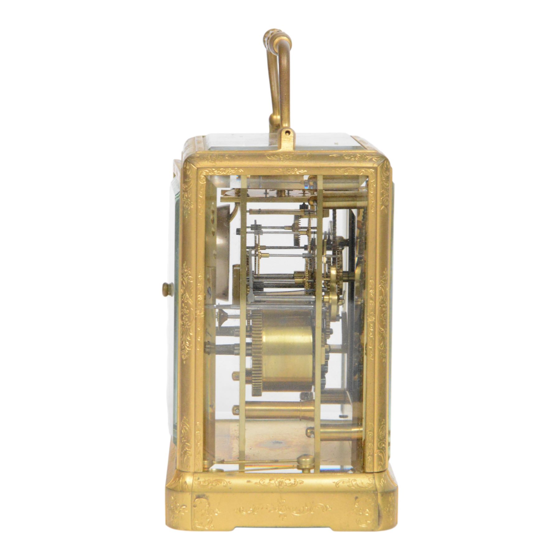 Late 19th century French 8-day brass cased carriage clock, Henry Marc of Paris, the gorge case with swing handle and four bevelled glass panels, white enamelled dial with Roman numerals and minute markers and steel hands, the two train movement with platform lever escapement, hour striking on a bell, with key