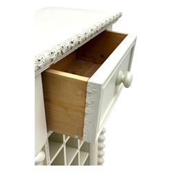 Contemporary painted wooden wine cabinet, rectangular form with carved leaf moulded cornice over single drawer and fifteen bottle compartments, flanked by spiral twist pilasters; together with a cream painted and chrome lantern, with glazed sides and leather handle (2)