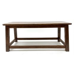 Medium rectangular oak coffee table, outplayed supports joined by perimeter stretcher 