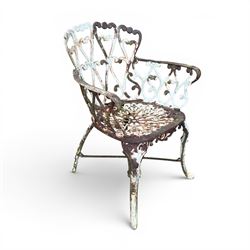 Pair of late 19th century painted cast iron garden chairs, open scroll and heart backs, ornate circular seat, raised on cabriole legs with X stretcher