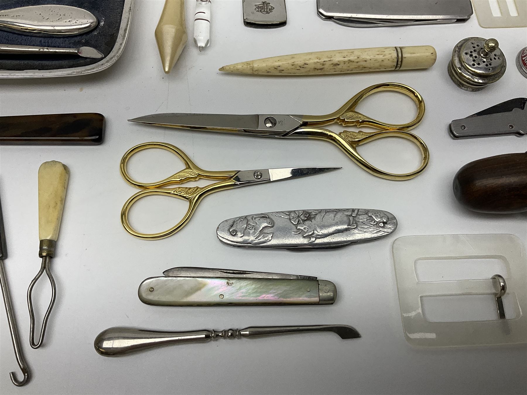 Pair of Wedgewood jasperware unicorn cufflinks, silver handled part manicure set, enamel flip notebook, dolls leather gloves, Stratton compact, and a collection of sewing accessories including thimbles, button hooks, thimble holder, scissors etc 