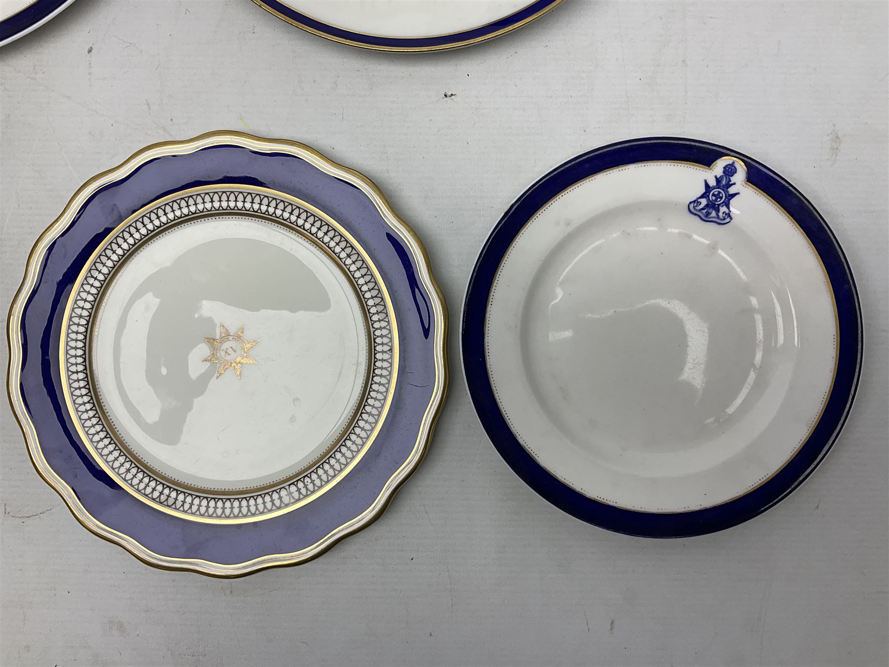 Collection of Regimental dinner wares, Comprising Royal Sussex; two dinner plates, two side plates and a soup bowl, Royal Leicestershire; two dinner plates, East Yorkshire Regiment side plate and Gordon Highlanders side plate, all decorated with the regiment's crests and blue and gilt boarders (9)