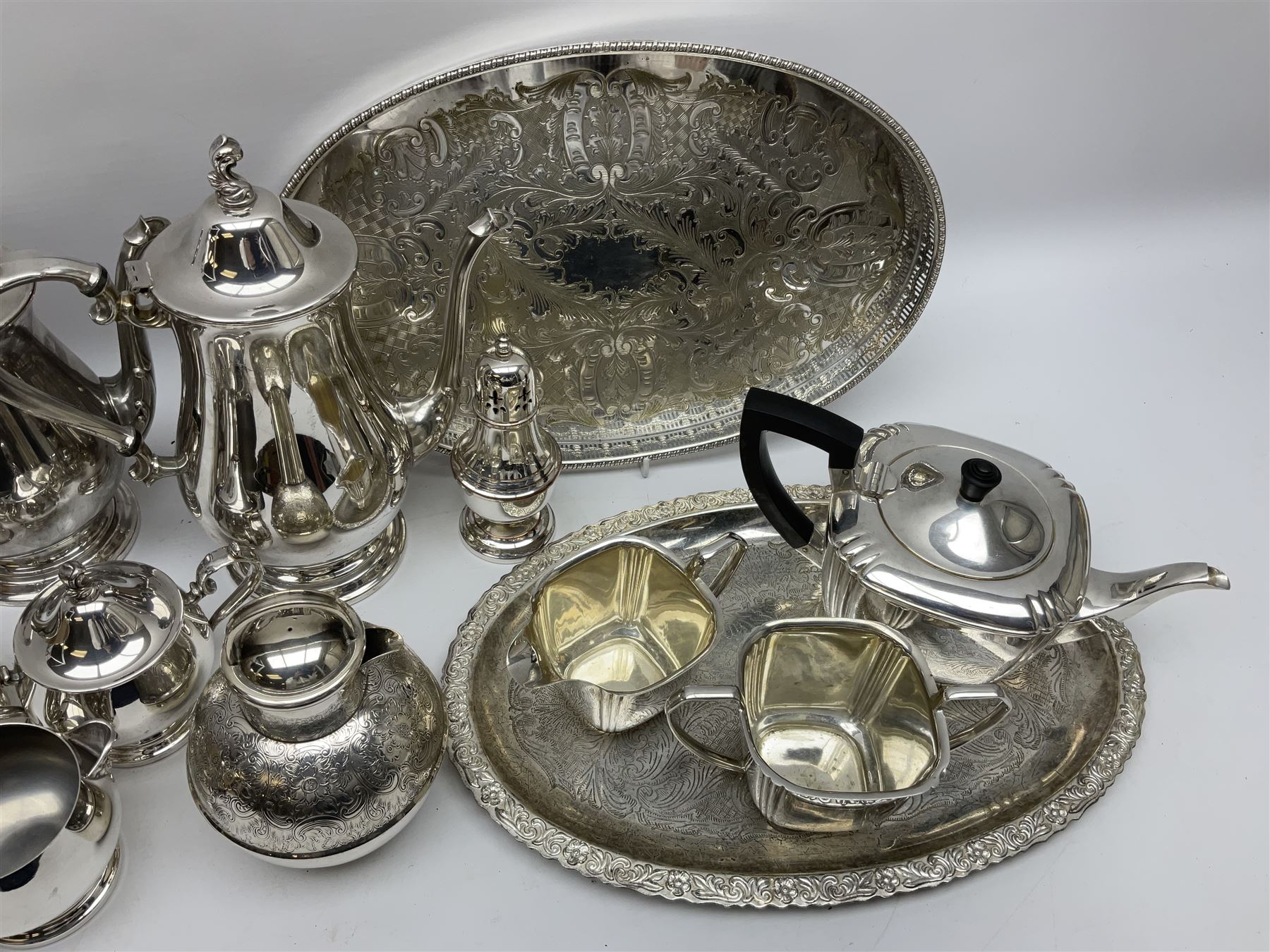Silver plated tea set by H Fisher & Co of Sheffield comprising tea pot, open sucrier and milk jug, Viners of Sheffield 'Chased' tray, Onedian USA silver plated tea and coffee pots with lidded sucrier and jug, and other plated and similar items