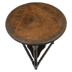 19th century country oak circular occasional table, featuring three triangular drop leaves, above shaped middle tier shelf, raised on bobbin turned legs and joining stretchers