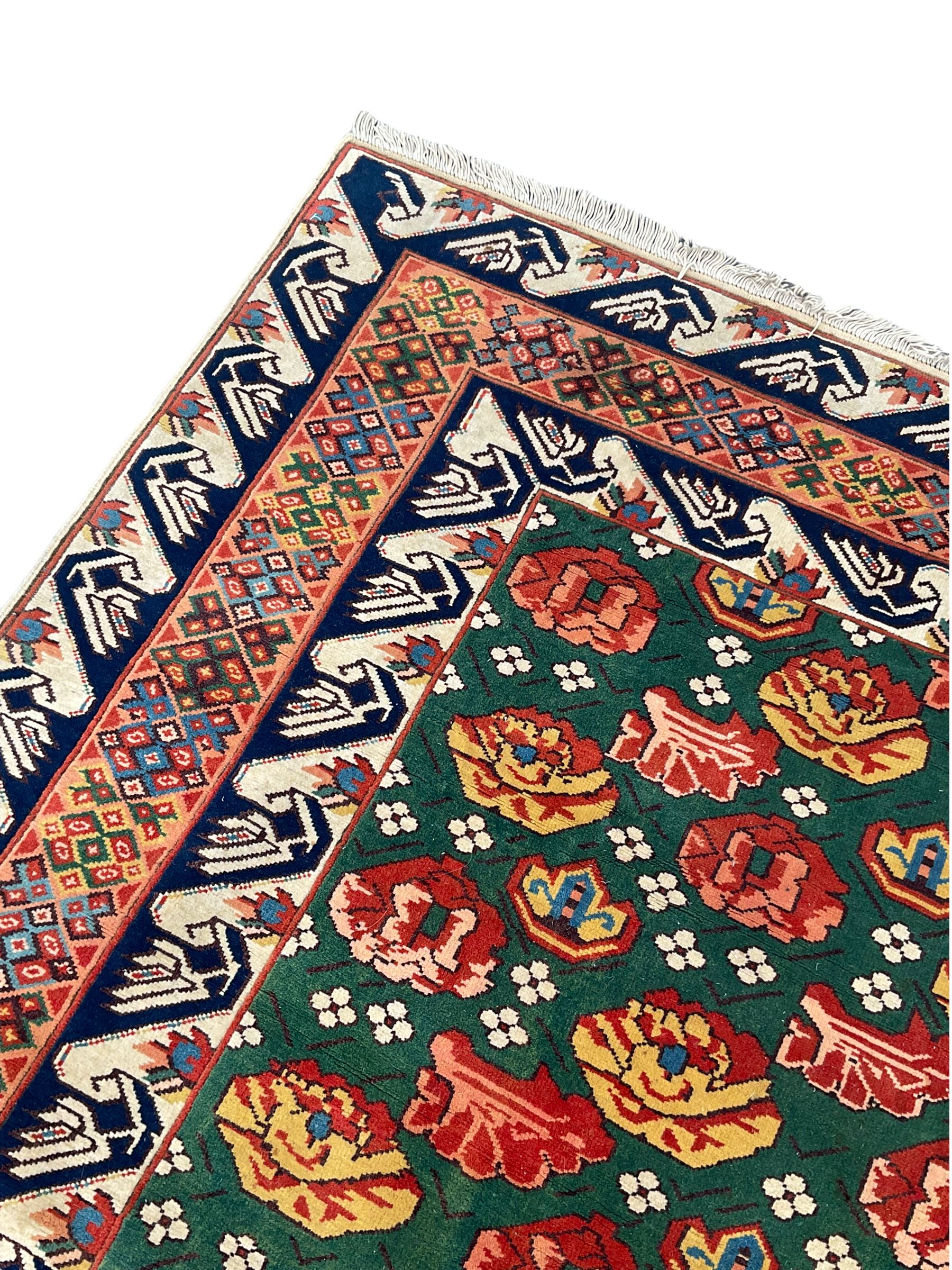 Turkish rug, decorated with stylised plant and floral motifs The