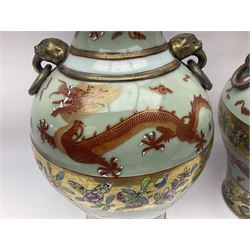 Pair of early 20th century Chinese vases decorated with dragons chasing a flaming pearl, with a gilt border of butterflies and floral sprigs, with Elephant head handles, H44cm 
