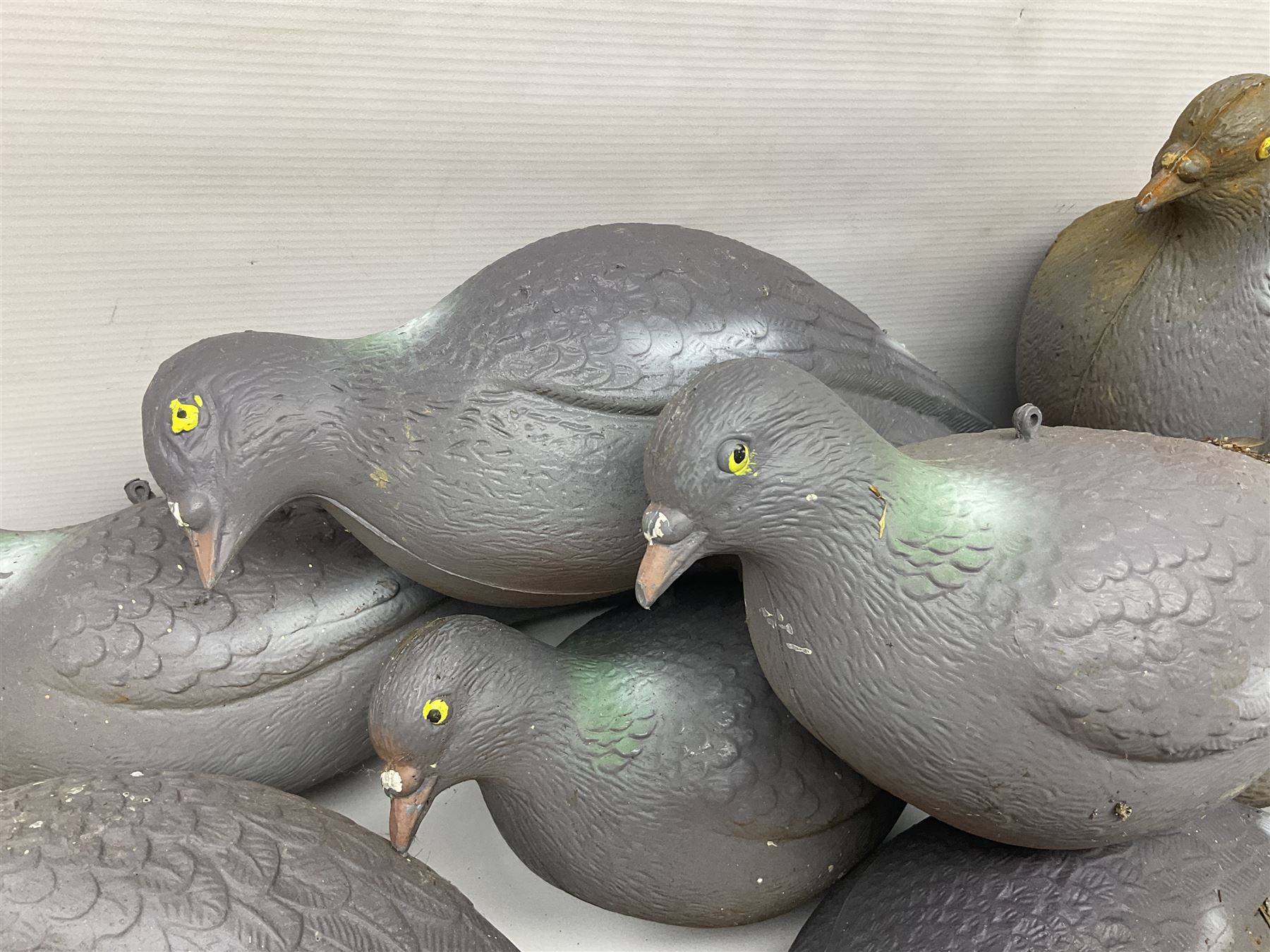 Eighteen plastic pigeon decoys comprising ten full body and eight shells with quantity of various stakes; some marked made in Italy