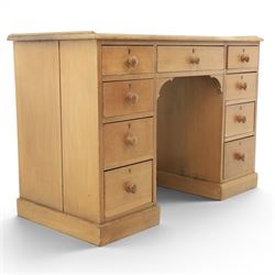 20th century ash twin pedestal desk, gadroon galleried top, twin bank of graduated drawers, plinth base