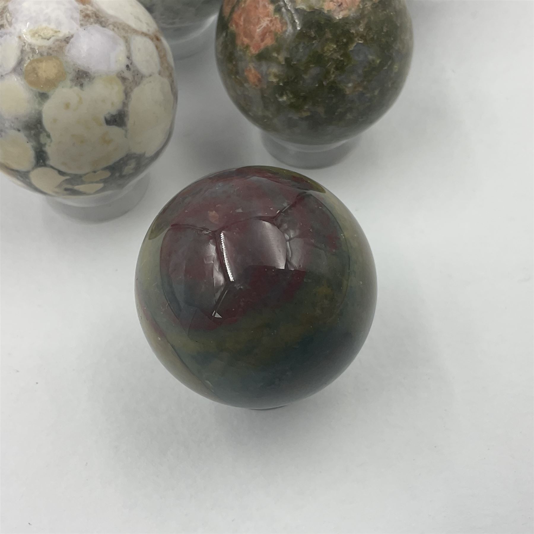 Six mineral specimens spheres, comprising jasper red, spotted agate, unakite, sardonyx, petrified wood and bloodstone, D2cm
