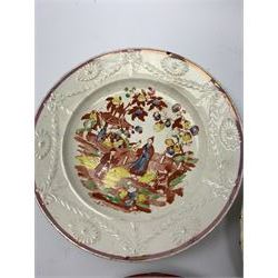Three 18th/19th century nursery plates, comprising example decorated with central printed chinoiserie scene of pagoda, fence and two figures with bird, within a moulded swag and patera border, D18cm, a William Smith & Co example decorated in the Napoleon pattern with moulded floral border, with printed mark detailed Napoleon WS&Co and faint impressed mark WS&Co's Wedgewood beneath, D18cm, and a pearlware example decorated with chinoiserie figural scene within a moulded border, with overpainted decoration, collectors label beneath inscribed 'Early Wedgwood or Leeds 1750-60', D16cm


