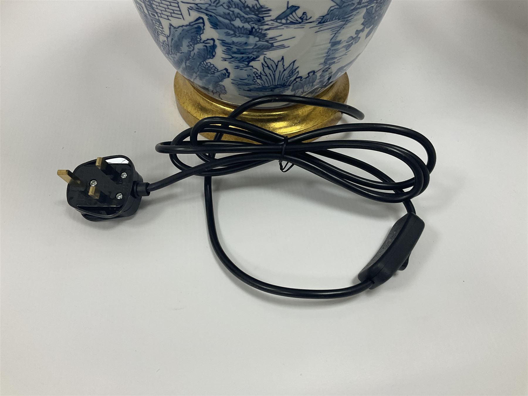 Pair of Chinese table lamps of baluster form, each decorated with landscape scene, raised upon gilt circular base, including shade H63cm