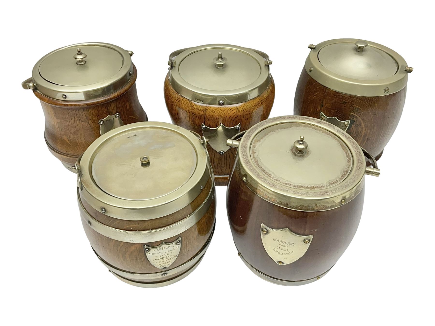 Five early 20th century biscuit barrels with silver-plated mounts, one made from Mahogany from HMS Hindustan