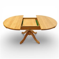 Wharfedale Traditional Furniture - oak dining table and eight ladder back chairs, circular top with stowable leaf forming a large an oval top extending to 167cm, on four splayed legs, together with eight ladder back chairs with green velour drop in seats