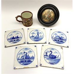 Five 19th century blue and white Delft tiles, each decorated with a central circular panel, containing buildings, boat, and swan, each approximately 13cm x 13cm, together with a Victorian Prattware transfer printed pot lid, and a Victorian lustre mug decorated with polychrome flowers. 