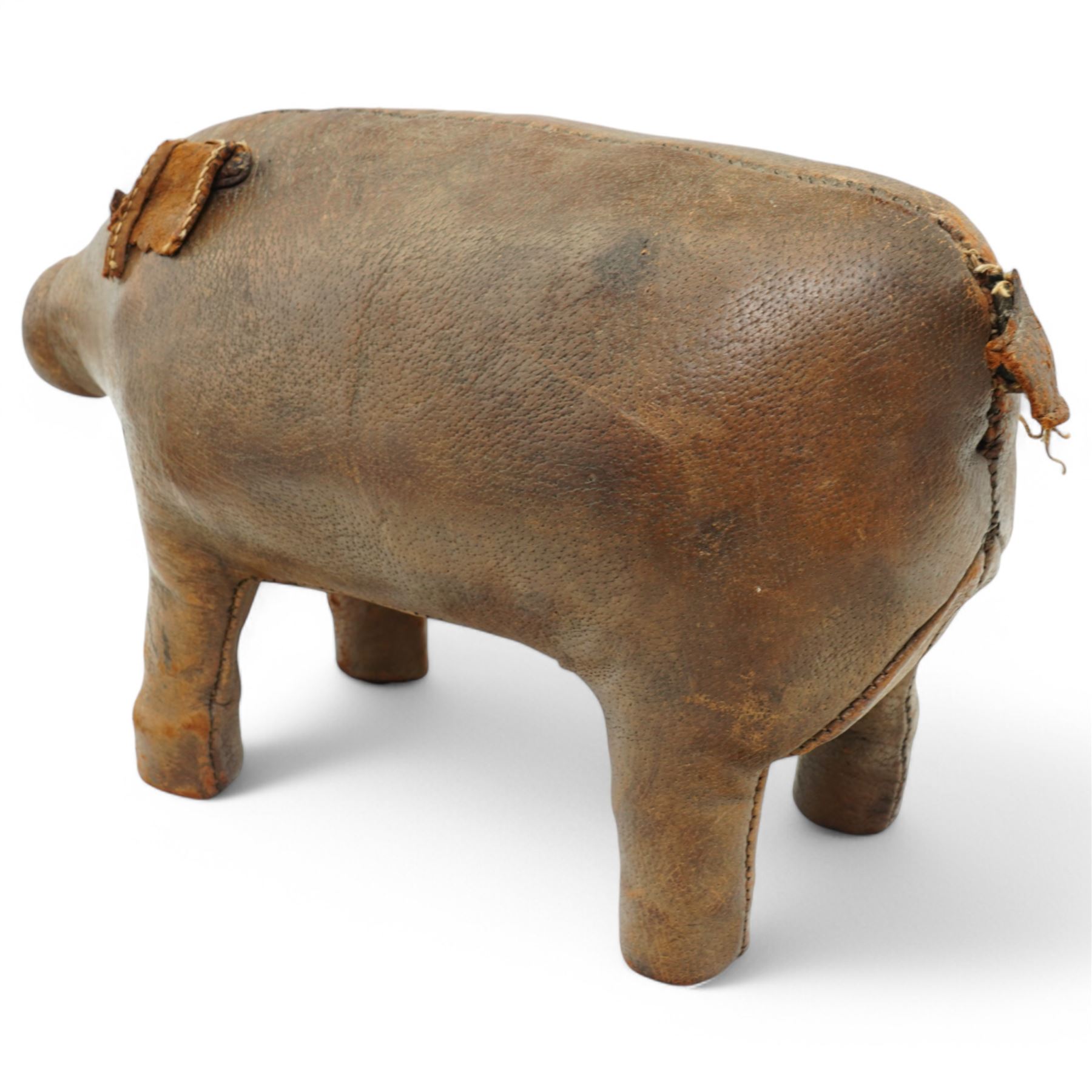 Dimitri Omersa (1927-1975) for Liberty's of London, two mid-20th century brown leather footstools, in the form of a pig and piglet, larger pig bearing Liberty stamp beneath ear, pig W86cm, piglet W49cm