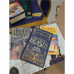 Eleven JK Rowling books, comprising six Harry Potter books, including four first editions, Fantastic Beasts screen play, Harry Potter and the Cursed Child, Tales of Beedle the Bard, Casual Vacancy first edition, Christmas Pig First edition and a Harry Potter card board back drop