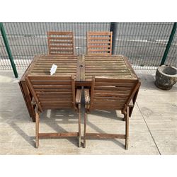 Rectangular teak drop leaf garden table, and four slatted armchairs