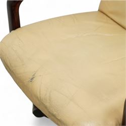 Dyrlund - contemporary pair of armchairs with solid Santos rosewood frame, rounded edges and broad armrests, seat and backrest with a removable cream leather over-stuffed cushions, together with a classic Dyrlund office chair with teak swivel base and cream leather upholstery, 62x44x109cm, (3)


Note: Dyrlund is a Danish furniture manufacturer known for its high-quality, handcrafted pieces, particularly in the mid-century modern style. Founded in 1960 by Frits Hjerte Dyrlund in Rude, Denmark, the company has remained a family business, now run by the second and third generations. Dyrlund specializes in both home and executive office furniture, focusing on practicality, solid construction, and classic design. 
