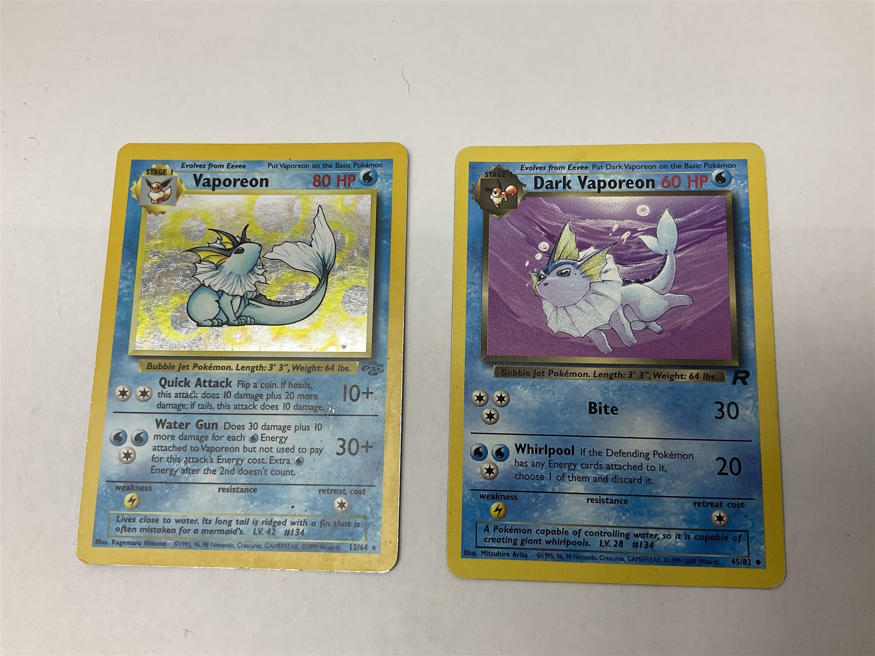 Collection of Pokemon trading cards, mostly 1999 Wizards Pokemon cards to include holo Charizard 4/102, first edition holo Machamp 8/102, further holographic cards; Dark Flareon 35/82 and Dark Vaporeon 45/82, cards from themed sets and 4th edition prints; 1998 Electronic Pokédex with cardboard boxes for themed decks Blackout, Overgrowth and Power Reserve Jungle, along with a large quantity of energy and trainer cards 