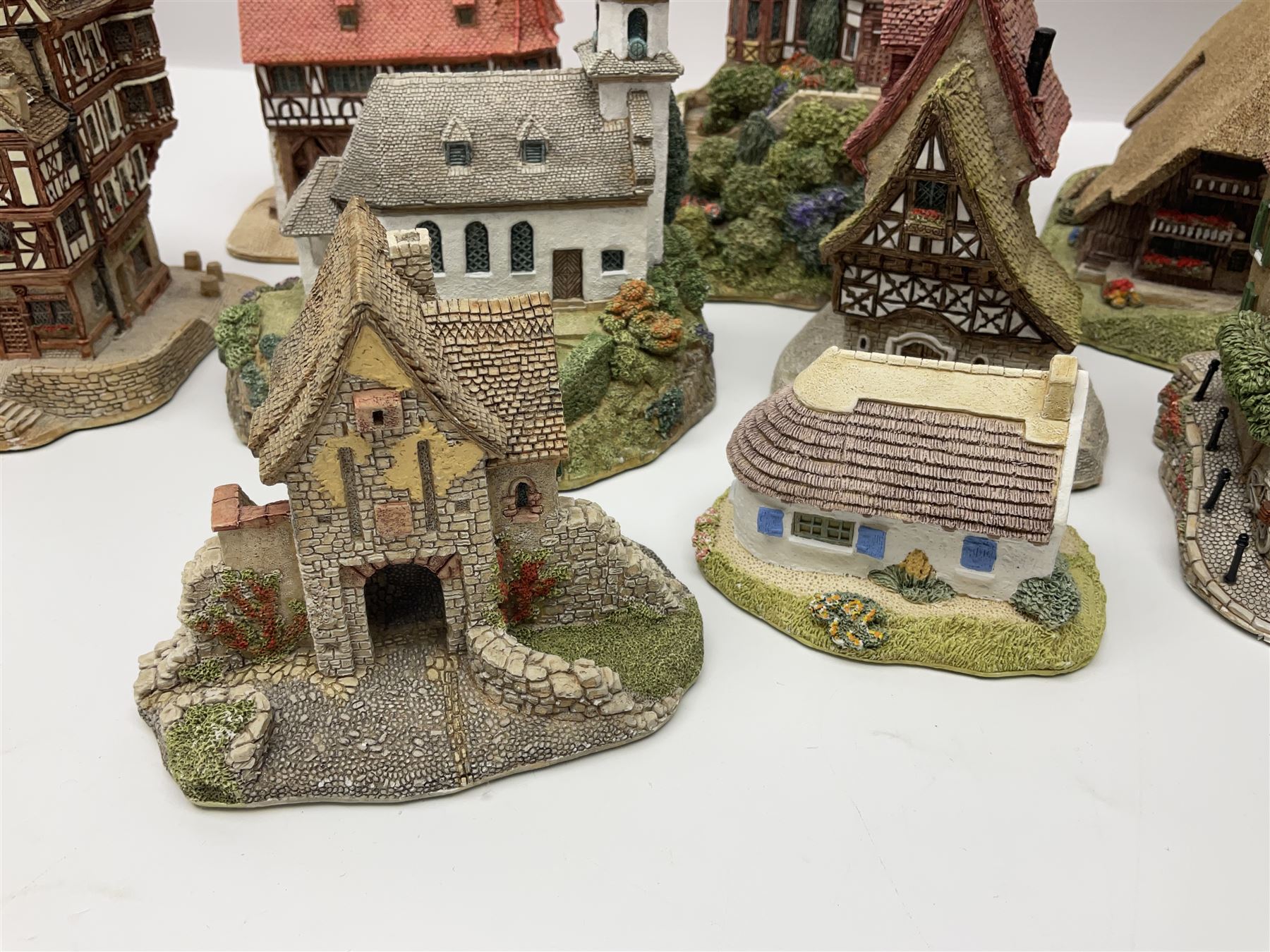 Sixteen Lilliput Lane models from the European collections, to include Dutch Collection; Aan de Amstel, Wipmolen, French Collection; Cabane De Guardian La, Porte Sachoenenberg La, German Collection Alte Schmiede, Das Rathaus, etc some with original boxes and deeds 