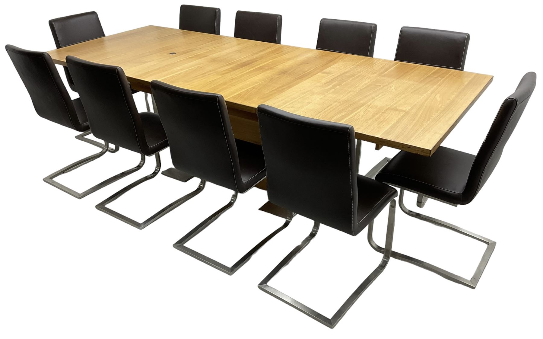Contemporary walnut extending dining table, rectangular pull-out extending action top with two additional leaves, on rectangular base with burnished metal feet (160cm - 258cm x 100cm, H78cm); together with a set of ten cantilever dining chairs upholstered in stitched brown leather, on burnished metal supports 