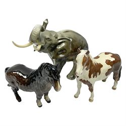 Three Beswick figures, comprising Skewbald Pinto Pony no 1373, Shetland pony mare, model 1033 and Elephant with trunk raised, all with printed mark beneath, largest H20cm 