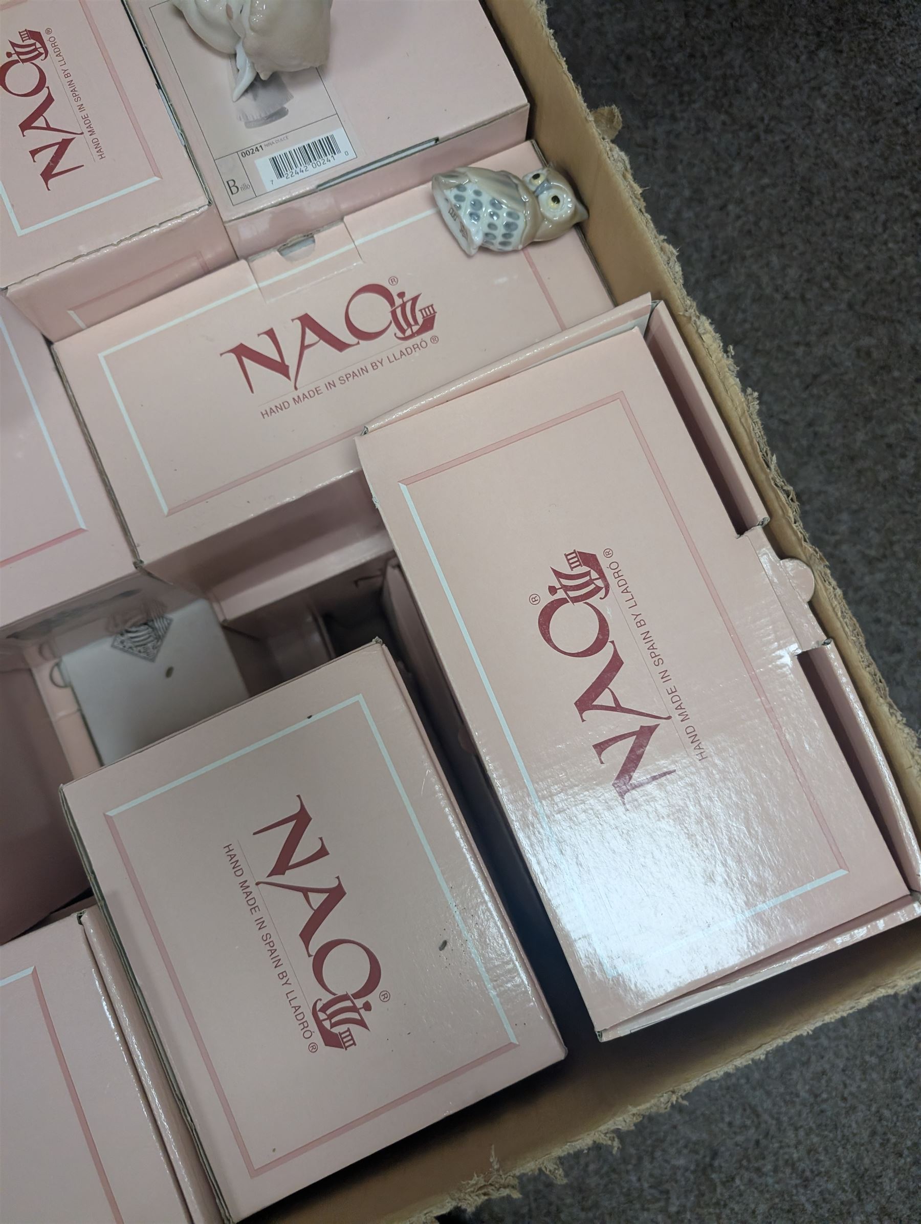 Collection of Nao figures, including boxed examples, in two boxes
