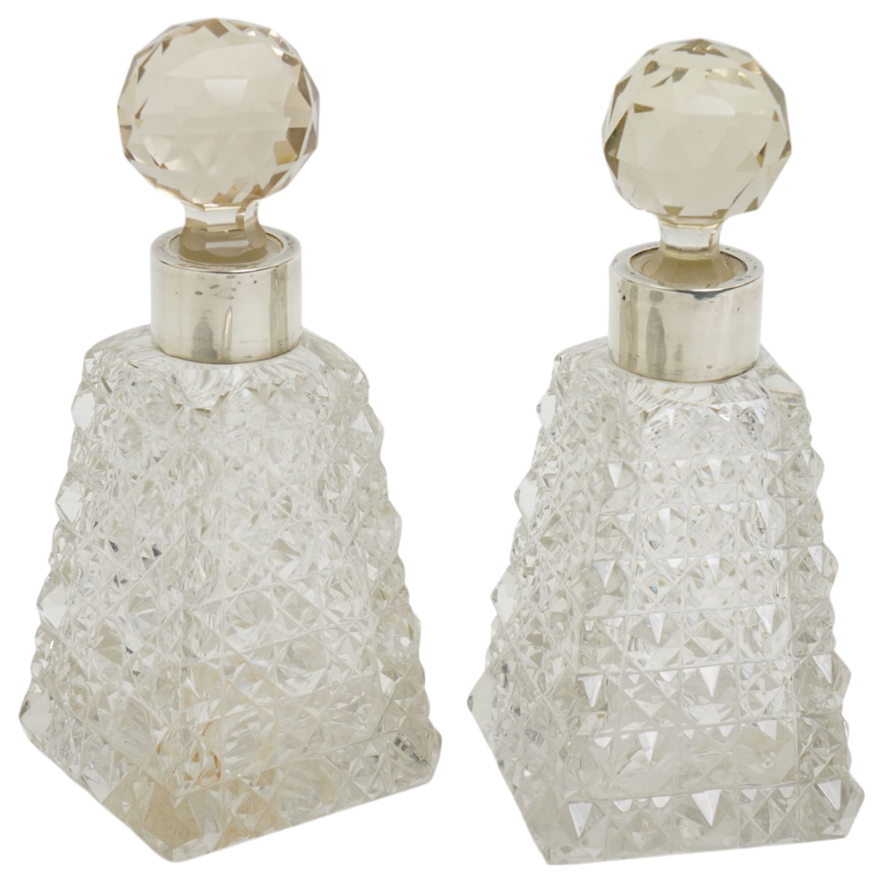 Edwardian silver backed hand mirror decorated with angels heads Chester 1903 and pair of Victorian glass and silver mounted scent flasks Chester 1894