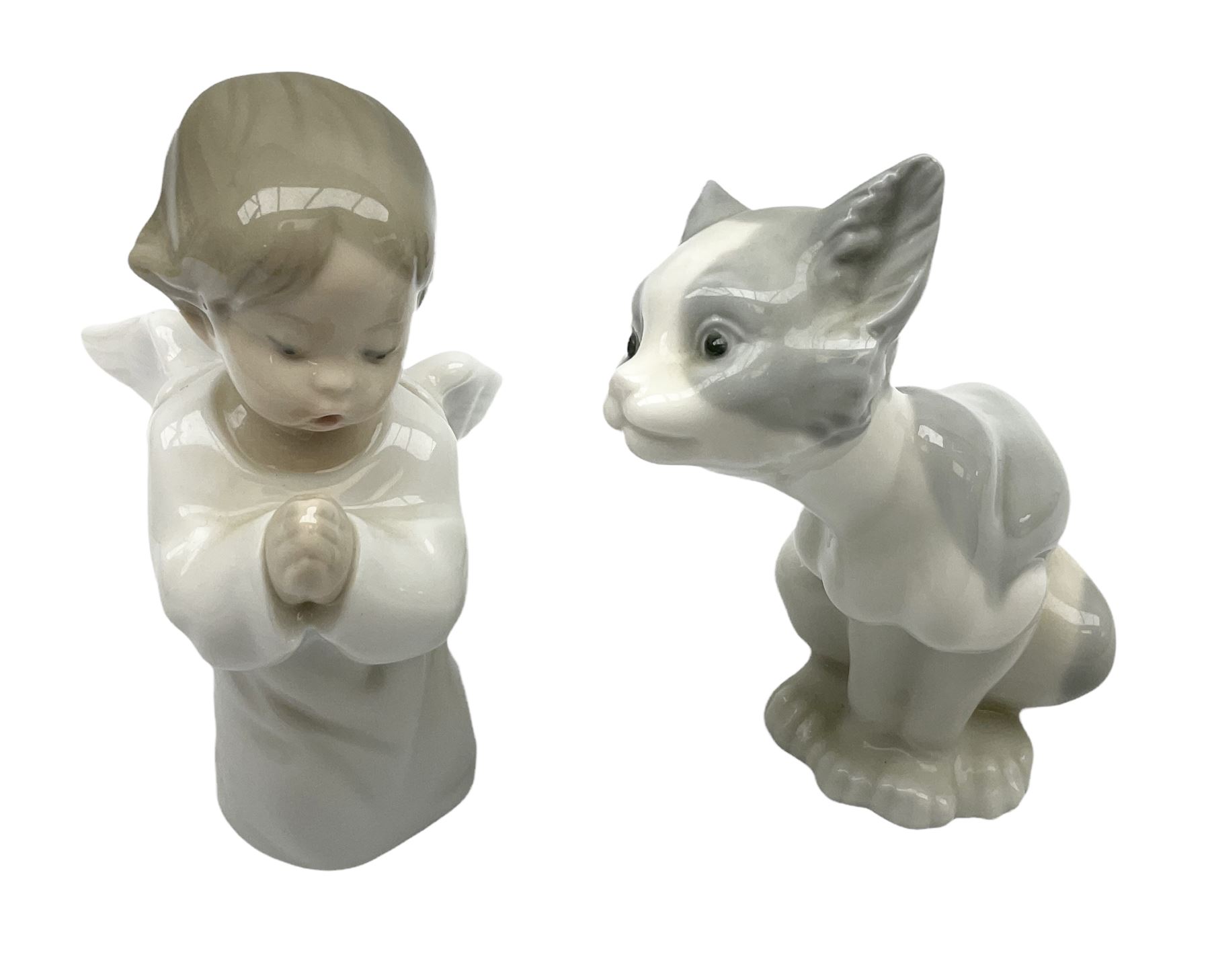 Lladro cat, modelled in a seated position, together with Lladro praying