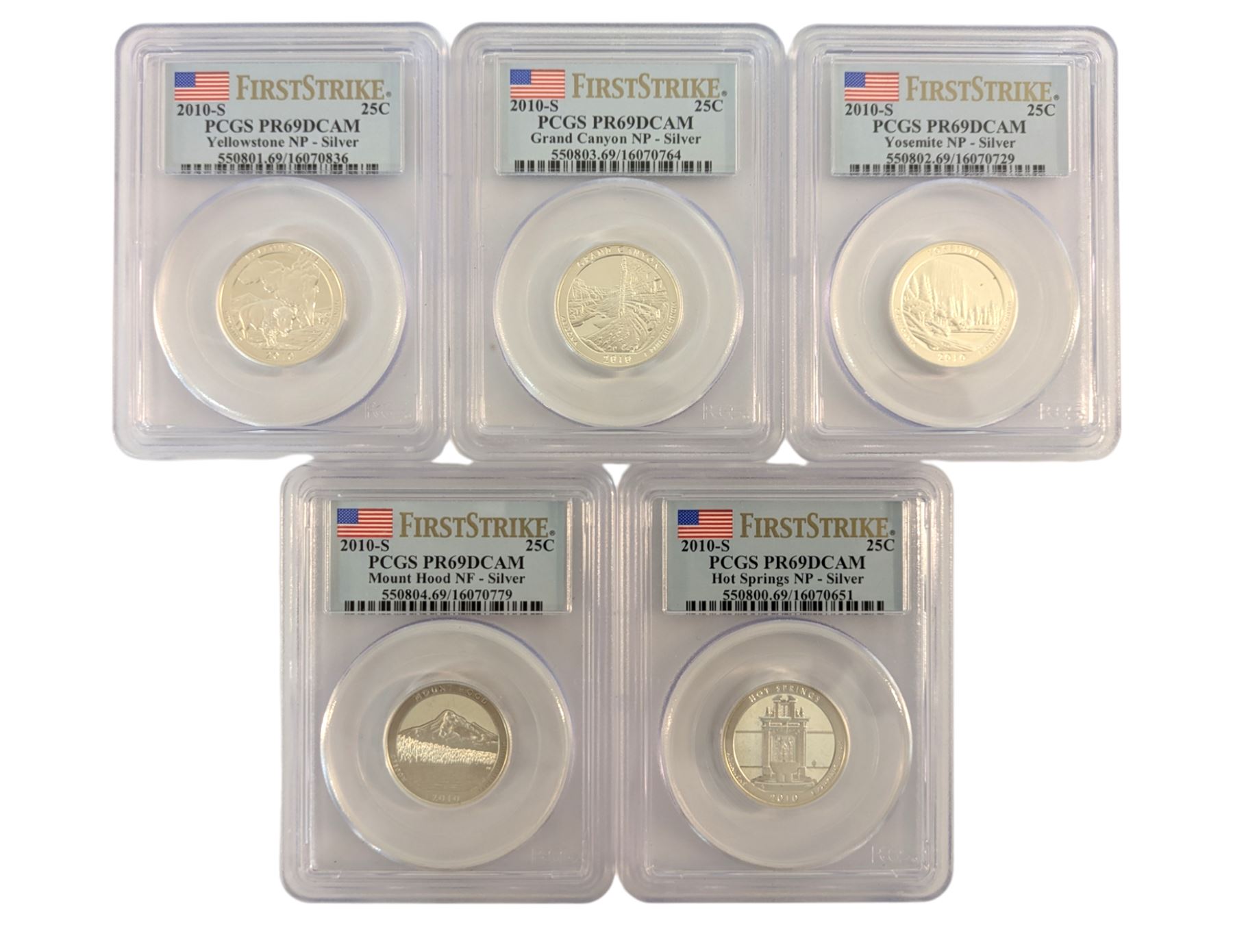Five United States of America first strike silver twenty-five cent coins, each encapsulated and graded by PCGS