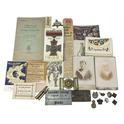Military related ephemera including Consolidated Instructions to Invasion Committees booklet July 1942; four WW1 silk postcards and others; 2006 Victoria Cross commemorative 50p coin collection; brass buckle marked Grenadier Guards; Lincolnshire Regiment cap badge; various collar badges, pips etc