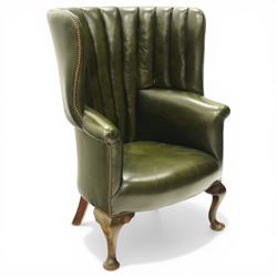 Georgian design green leather barrel-back wingback armchair, pleated upholstered back with shaped wings over scroll arms and sprung-seat, close nailed border, raised on cabriole supports terminating in pad feet
