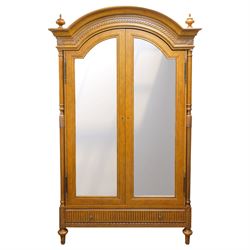 And So To Bed - French design ‘Eclectic’ double wardrobe in light finish, arched moulded cornice with carved foliate band and turned finials, two mirrored doors enclosing a hanging rail, flanked by turned columns with foliate decoration, single fluted drawer below, on turned tapering feet