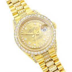 Rolex Oyster Perpetual Datejust ladies 18ct gold automatic wristwatch, circa 1983, Ref. 69178, serial No. 8058240, champagne dial diamond dot hour markers and outer diamond ring, after market diamond set bezel and lugs, on 18ct gold President bracelet, set with after market diamonds, with AIGL report and additional links